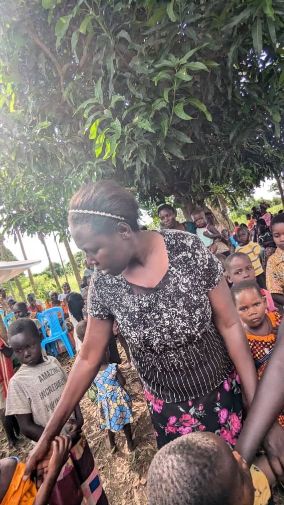 Turikumwe volunteers on a community home visit and outreach day
